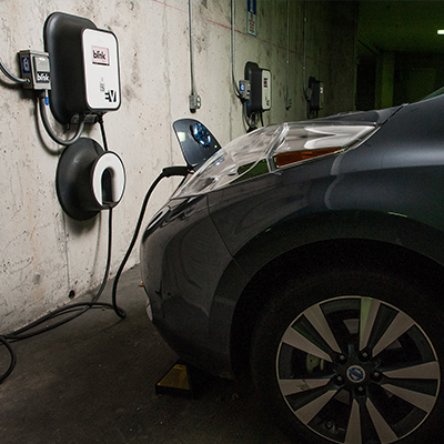 An electric car parked in Inman Parking Garage