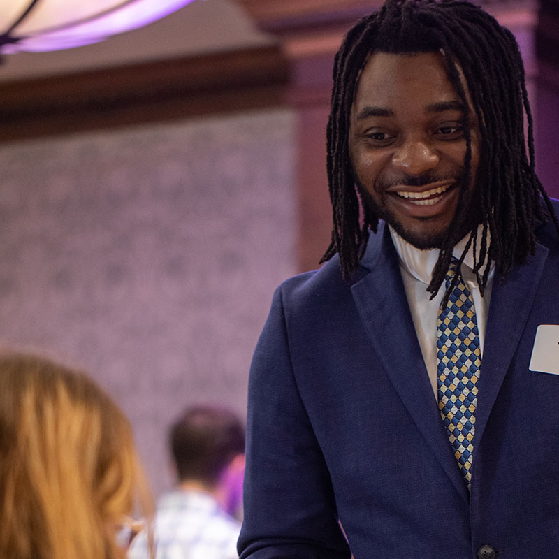 Student at a Career Fair talking with employers