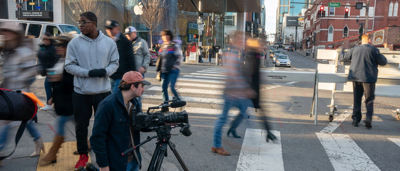 Students filming on Broadway in downtown Nashville.