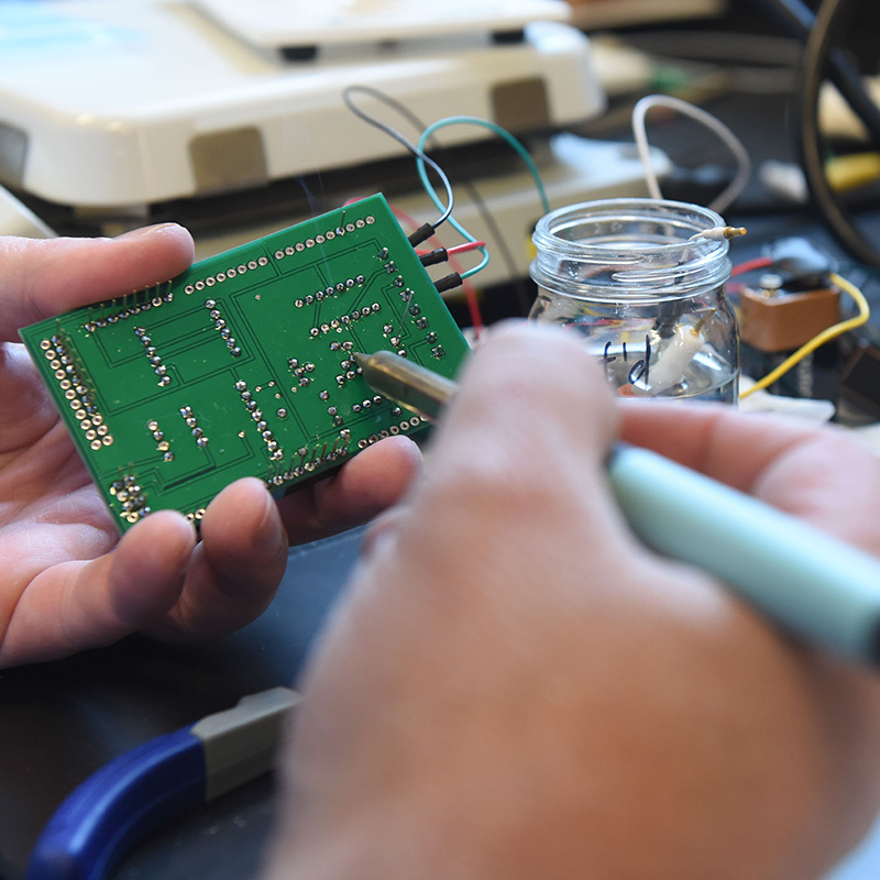 A close-up of a green circuit board.