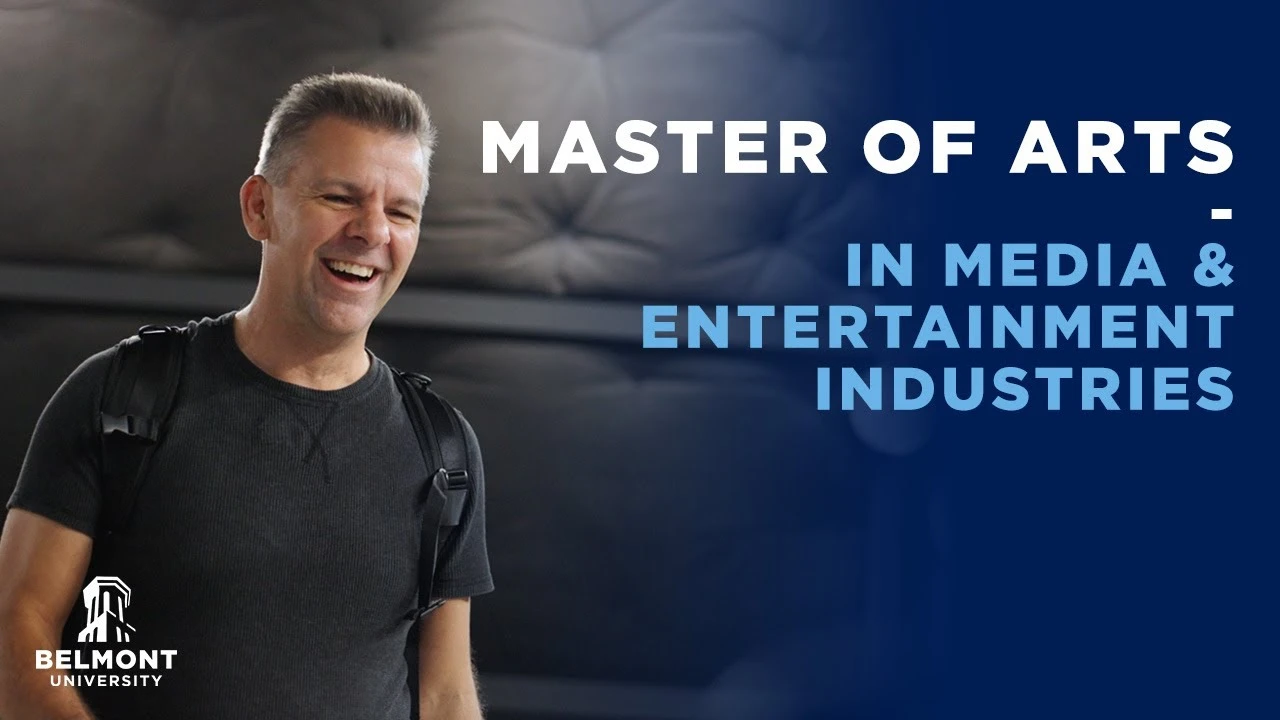 Smiling man wearing a black t-shirt and backpack stands in front of text reading 'Master of Arts in Media & Entertainment Industries' with the Belmont University logo in the bottom left corner