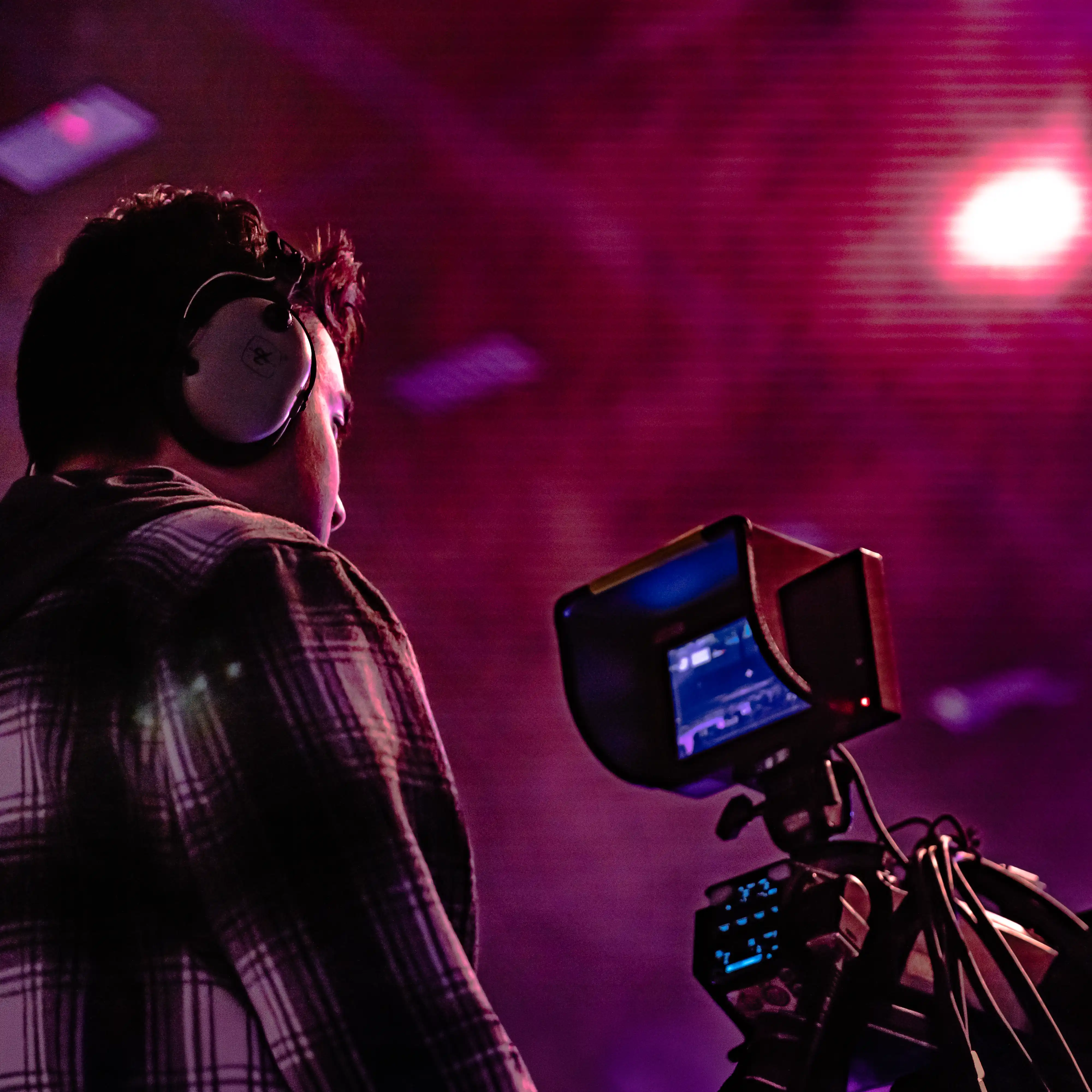 Student operates a professional cinema camera during a live production, gaining hands-on experience in cinematography, directing and live event broadcasting.