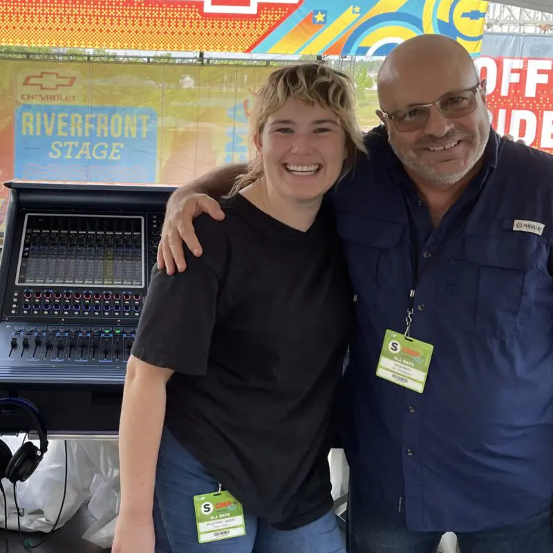 Alumna Emily Pikul posing with a coworker at CMA Fest