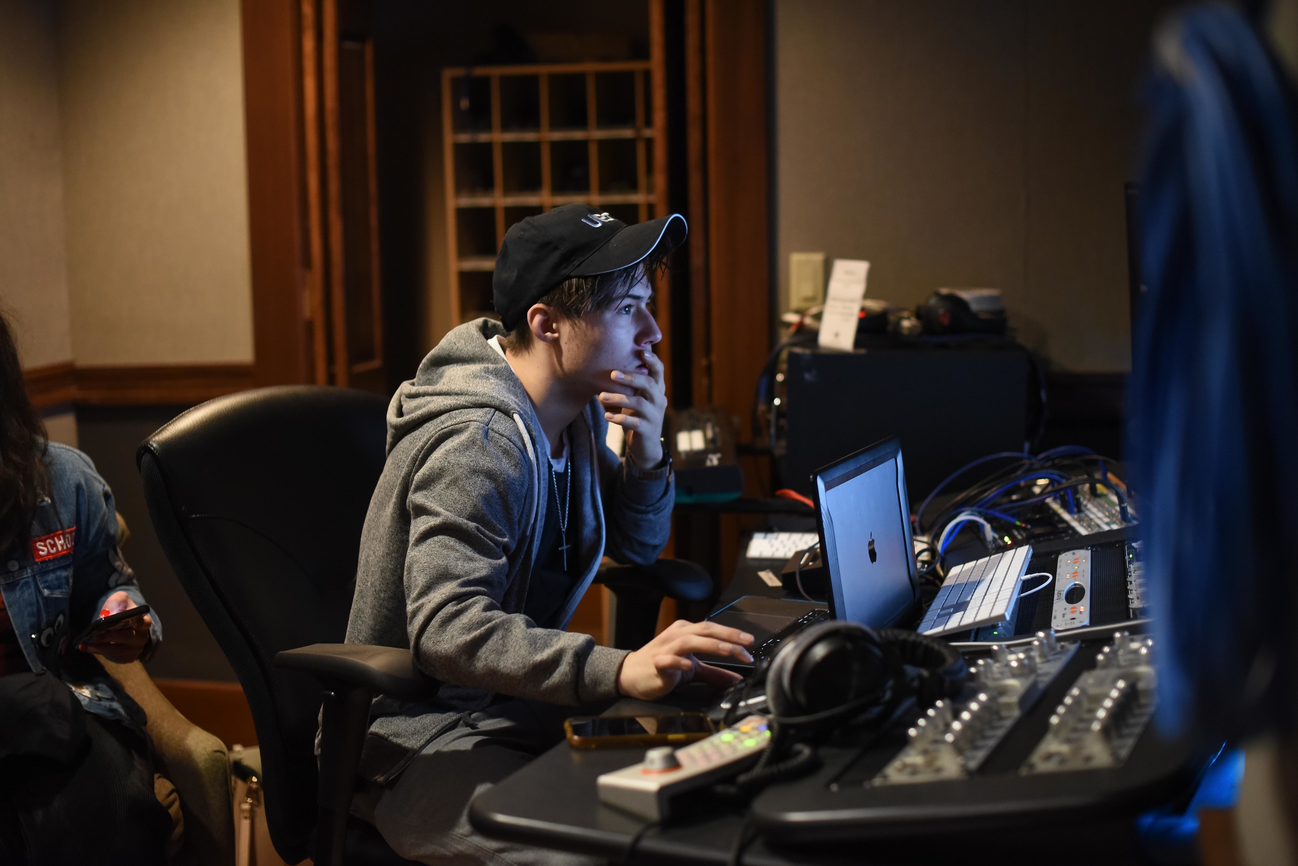 student at computer in studio. 