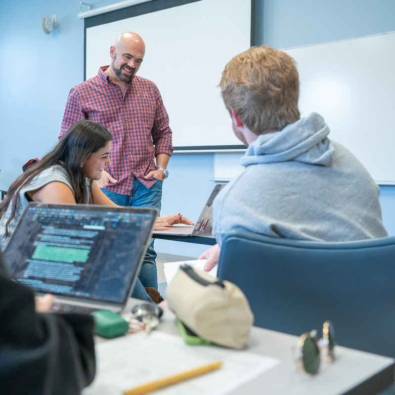 Professor lecturing class room of students