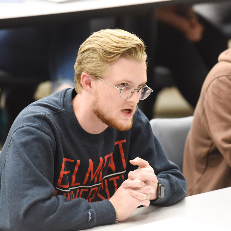 Student participating in class discussion