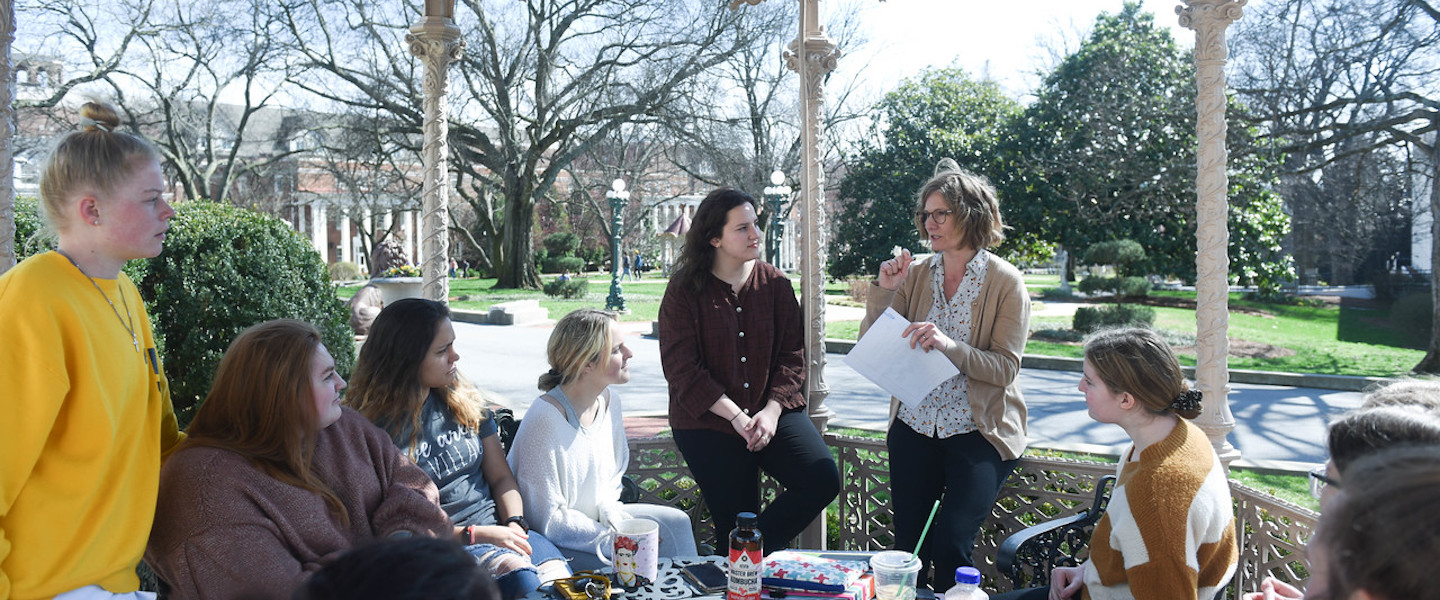 students have class outside on campus