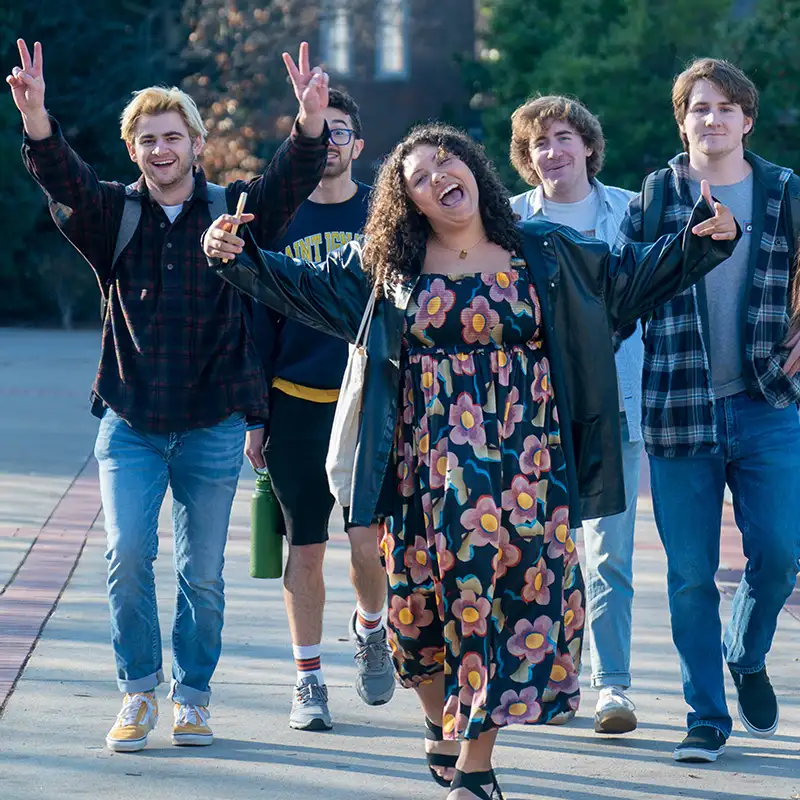 Students walking and making happy gestures