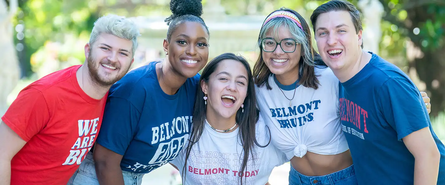 Five students smiling at the camera 