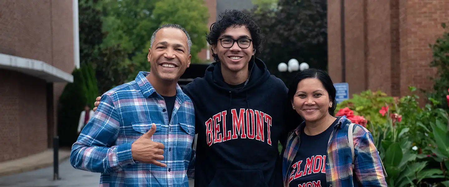 A male student with his mother and father