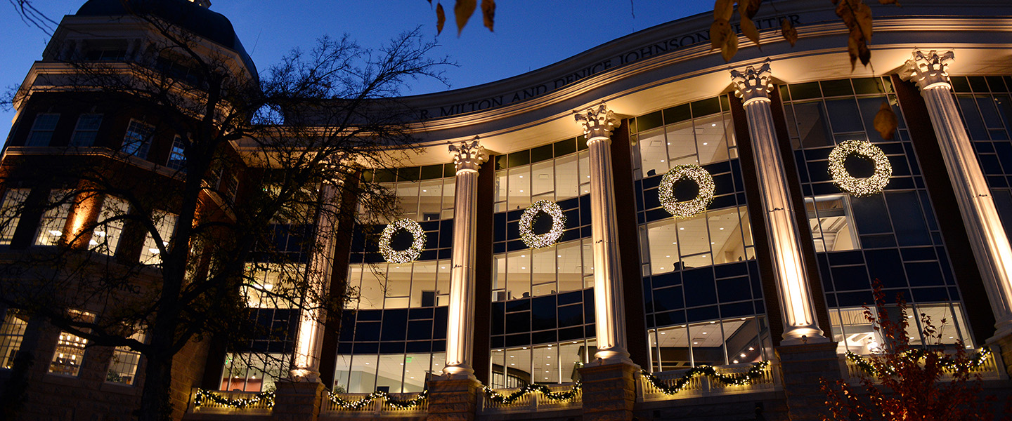 Wreaths on the Johnson Center at night