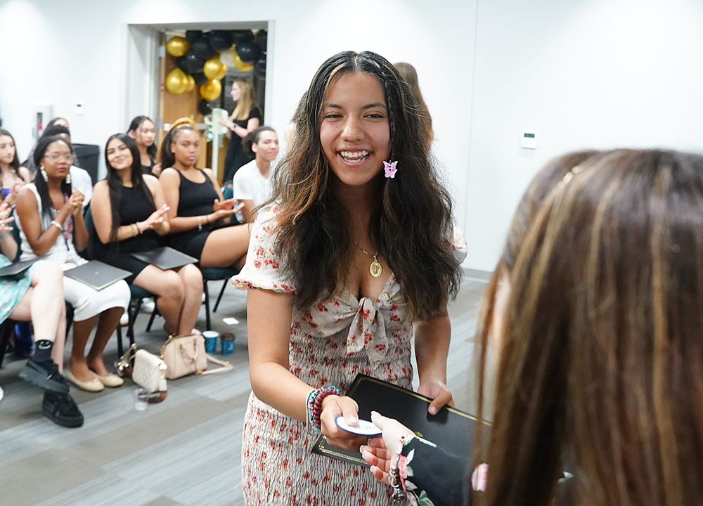 A student receiving her Bell Tower Scholarship