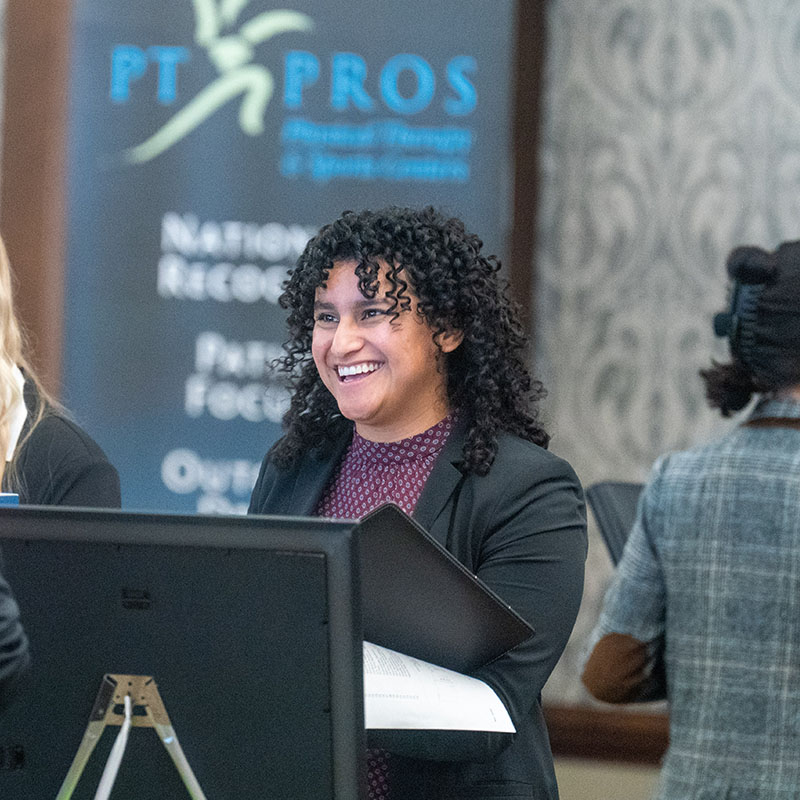 Student smiling at a job fair