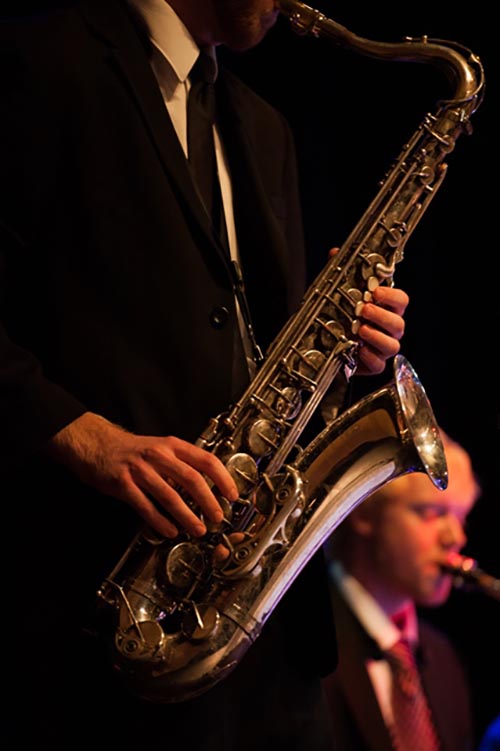 Close up of Jazz small group member playing sax