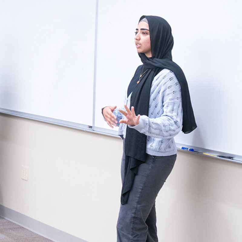 A student giving a presentation about voting