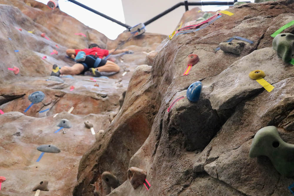 Student climbing the Rock Wall