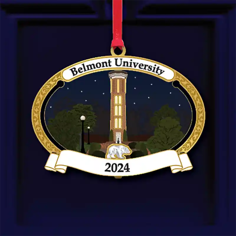 2024 Belmont University ornament featuring the illuminated Bell Tower at night, framed by trees and a gold decorative border.