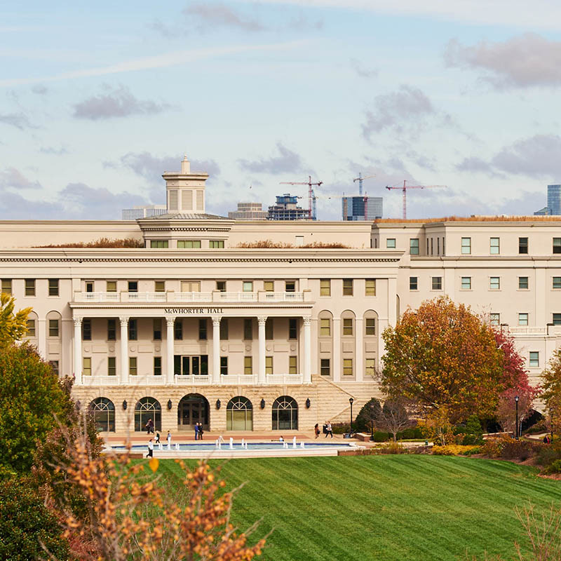 The main lawn on a cloudy day through the fall colored trees