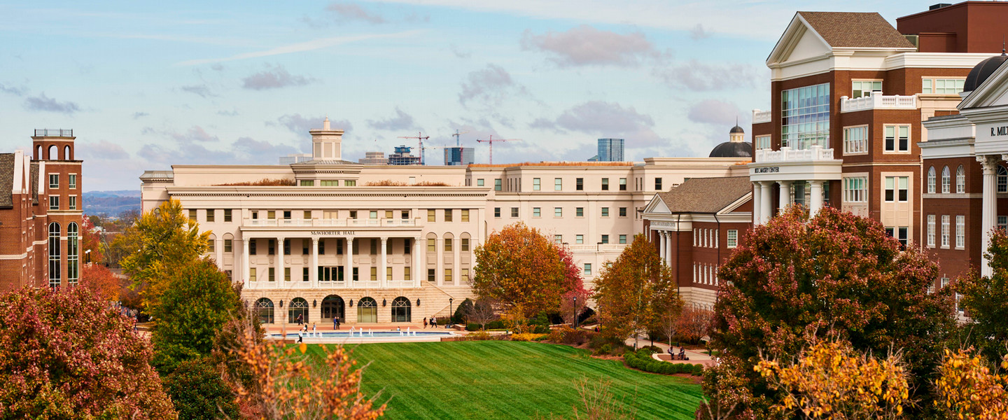 The main lawn on a cloudy day through the fall colored trees