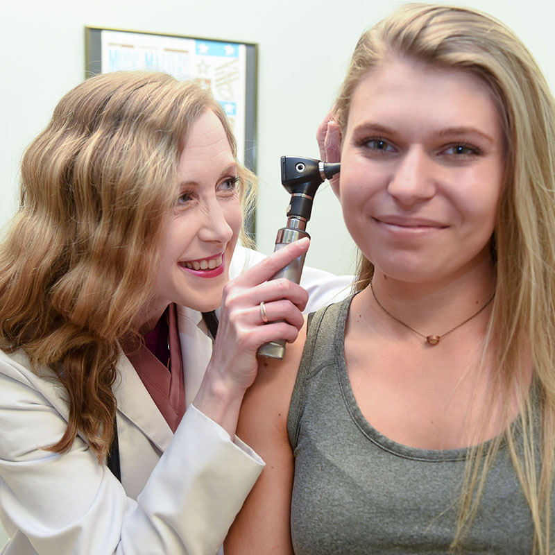 A student being examined by a nurse