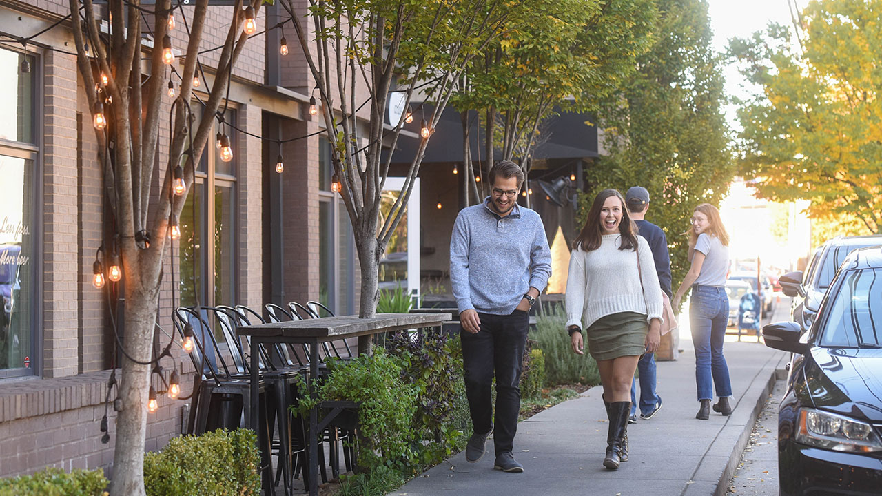 Students walking down a sidewalk in 12 South