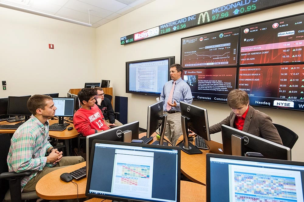 Massey classroom with students listening to professor