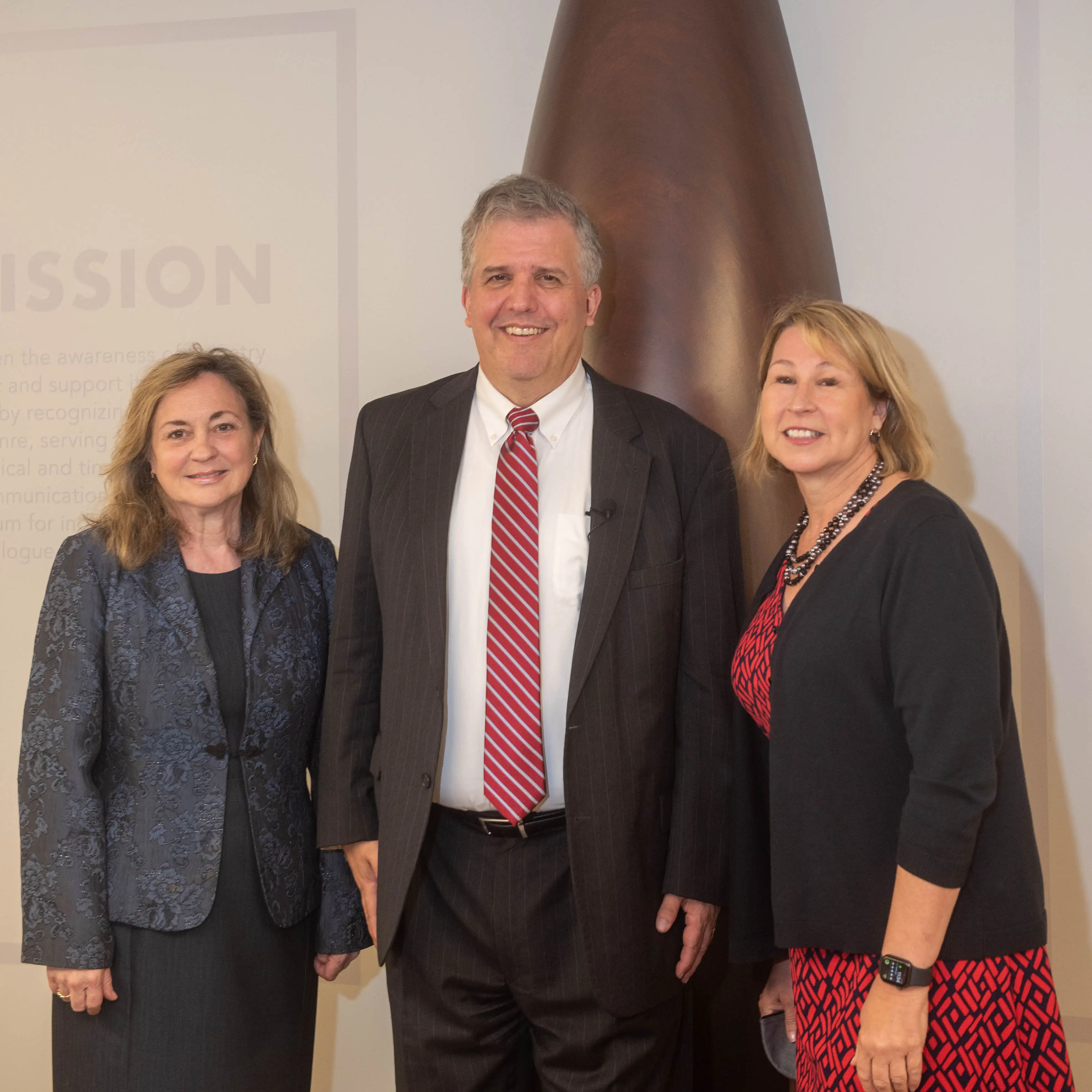 Sarah Trahern stands with Greg Jones and Susan Jones