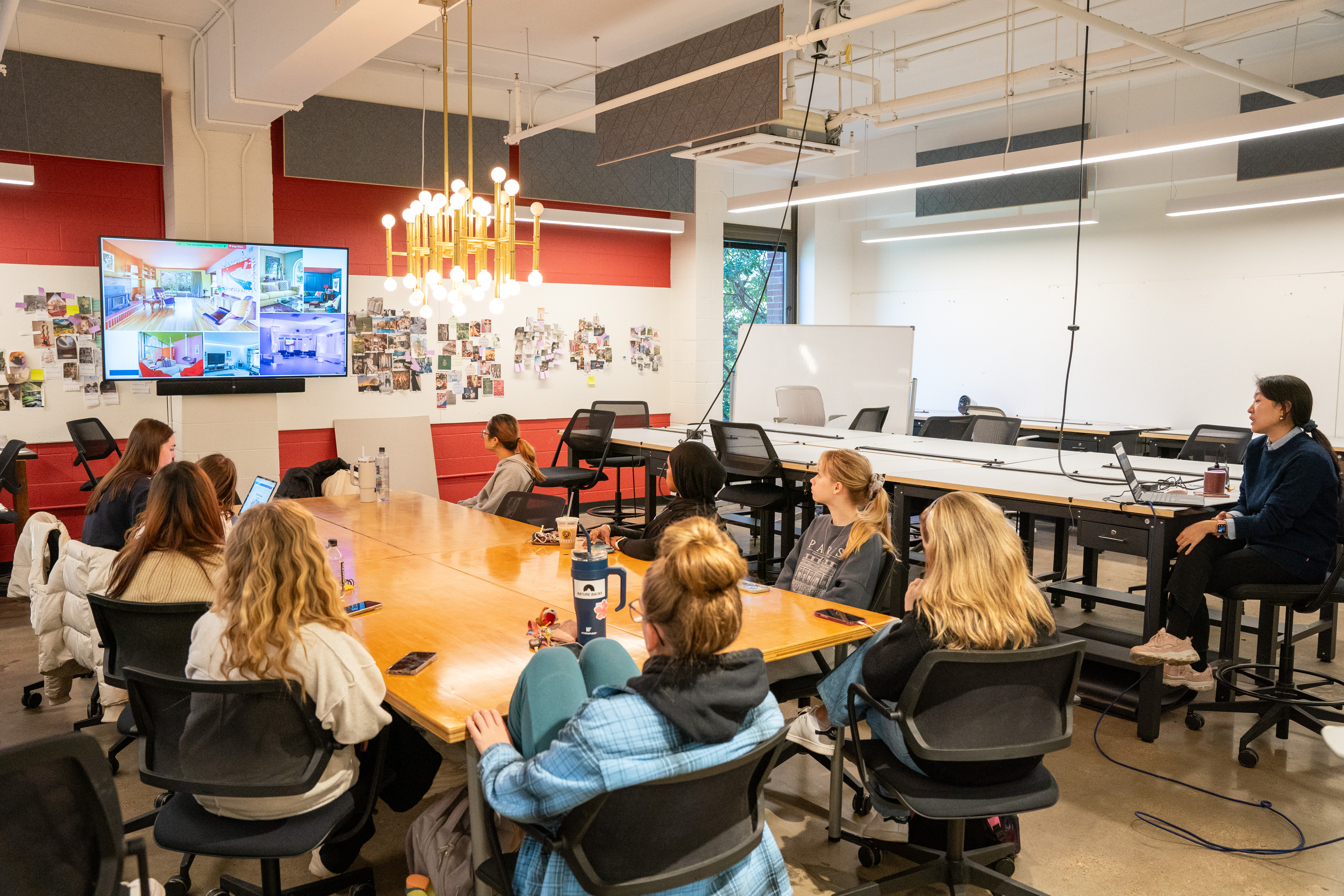 interior design students sitting in studio learning rendering