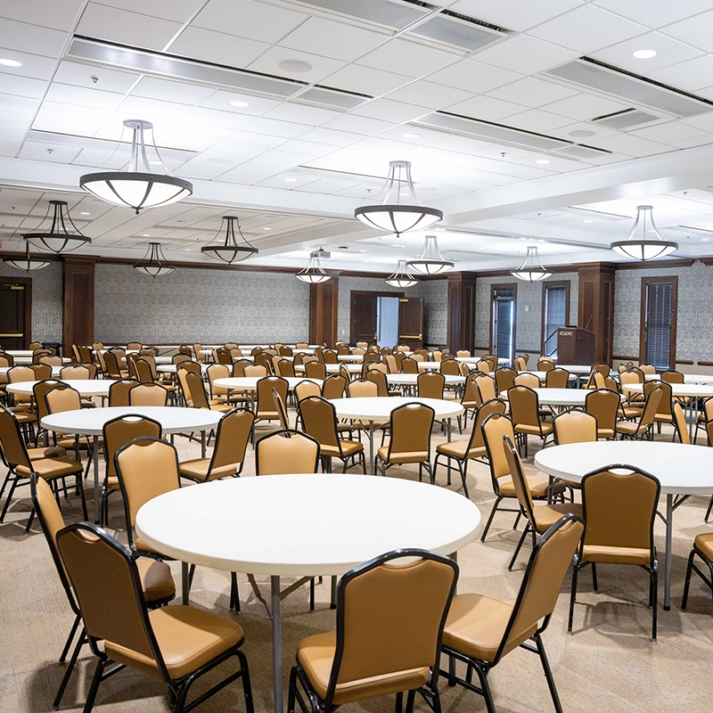 Empty tables and chairs in a large room