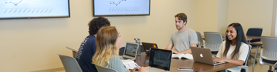 Students Studying at a Table in Massey