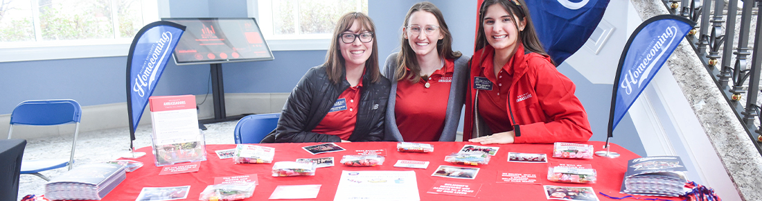 Belmont student ambassadors sitting at a table