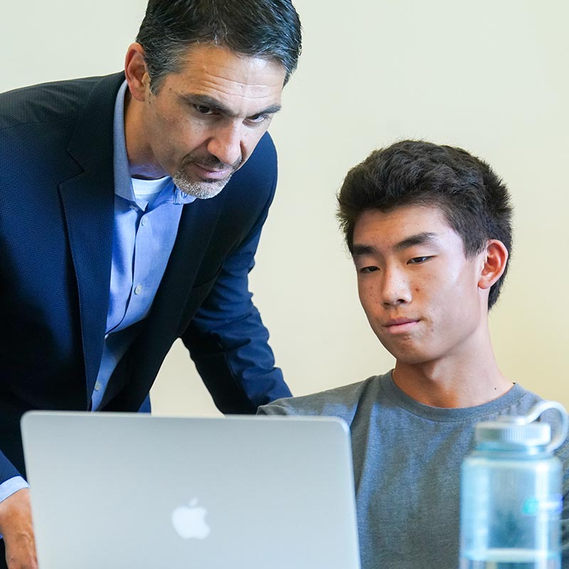 A student working with a professor