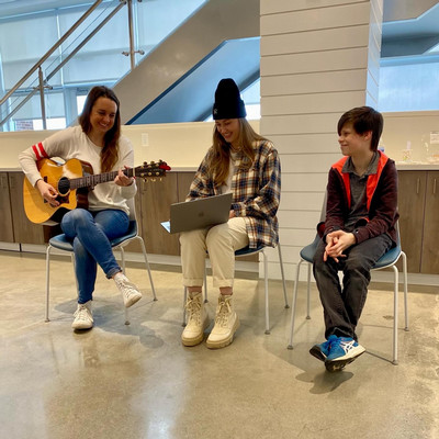 songwriters with poetry contest finalists, all smiling