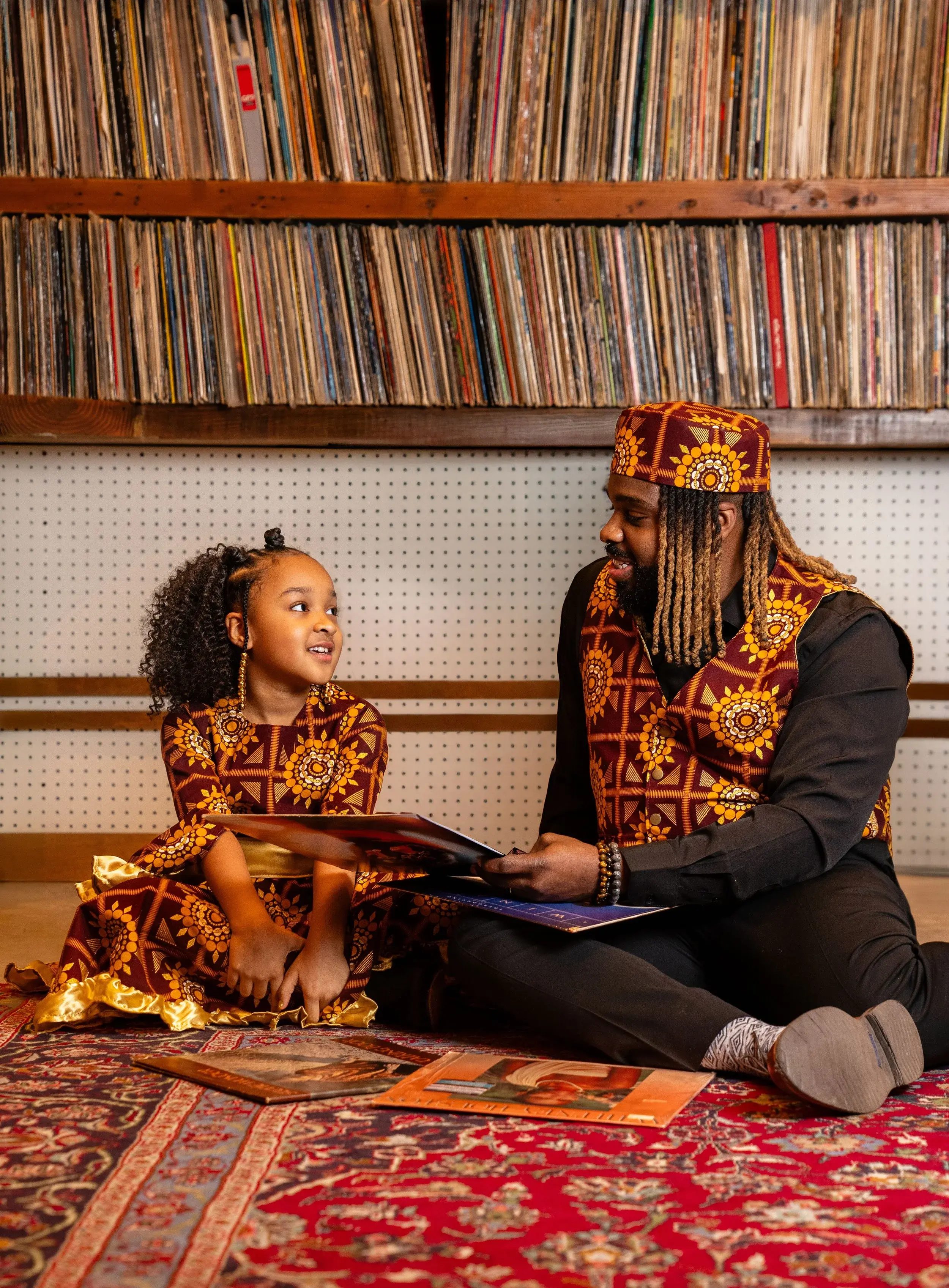 Fyutch showing his daughter some classic records