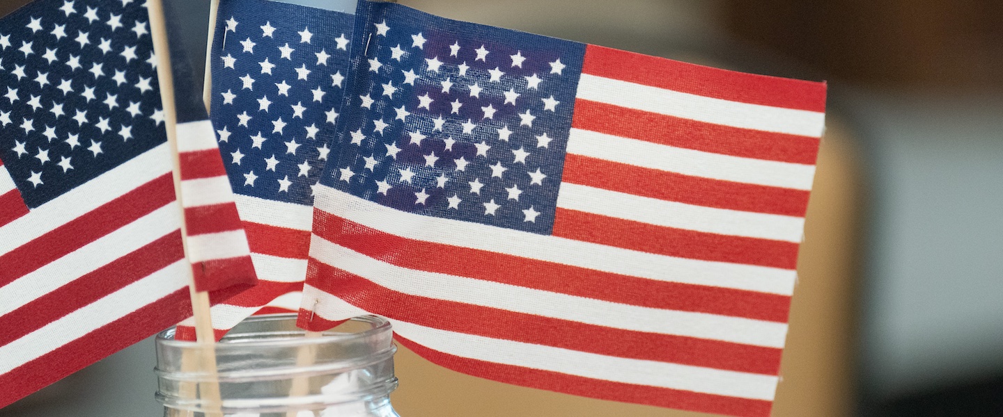 American flag in a vase on a table