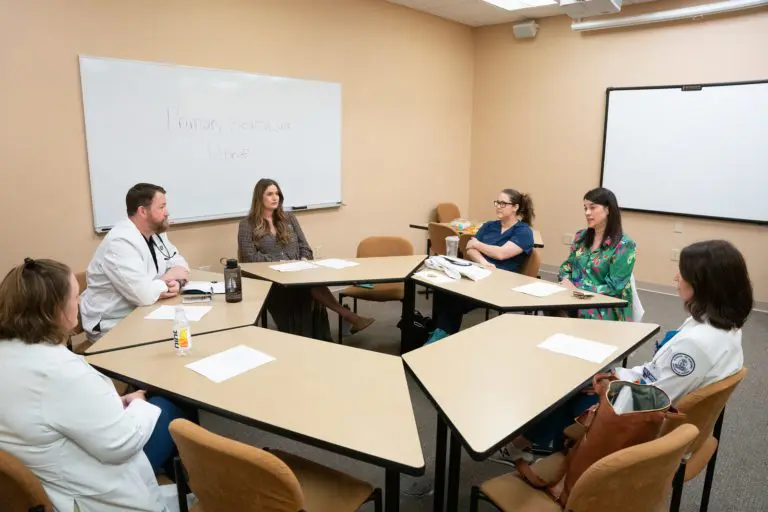 Graduate nursing students debrief after simulation