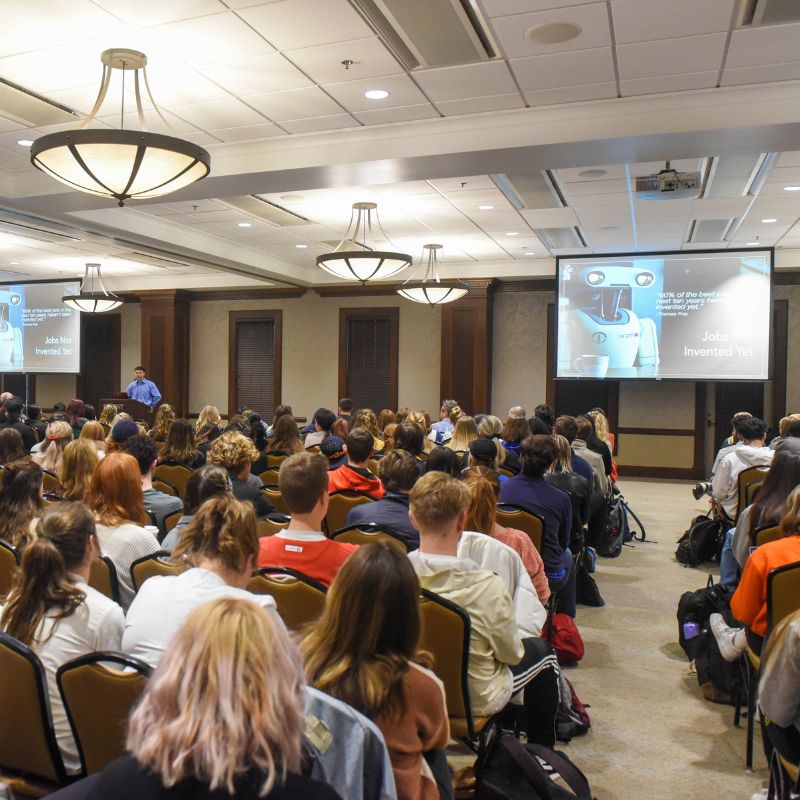 Alt TextConference room full of students attending computer science lecture