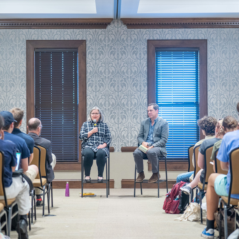 Margaret Renkl and Dr. Pete Kurlya speak in front of students