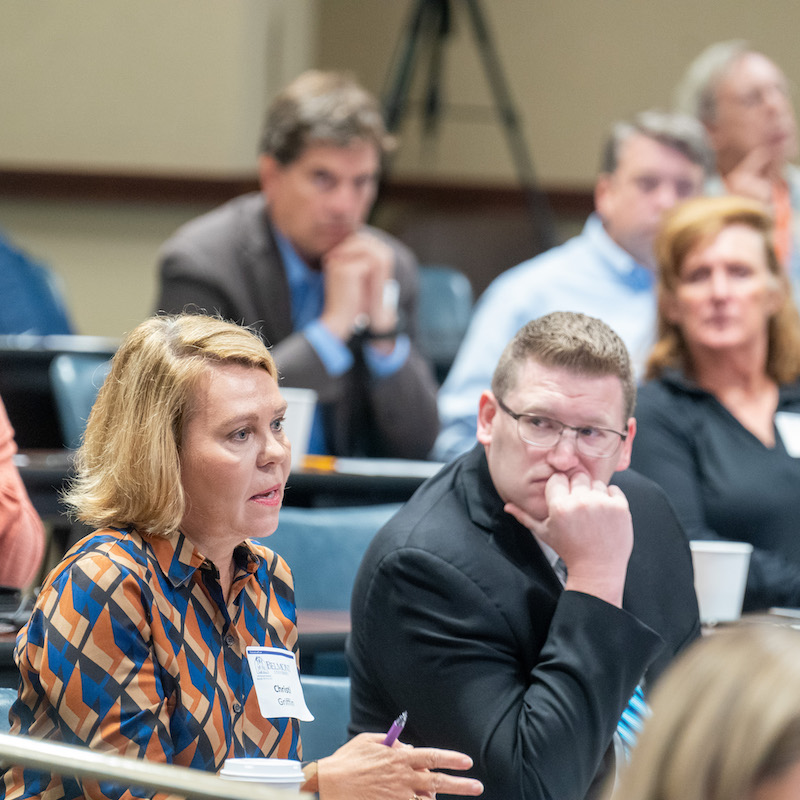 Two attorneys at the law symposium