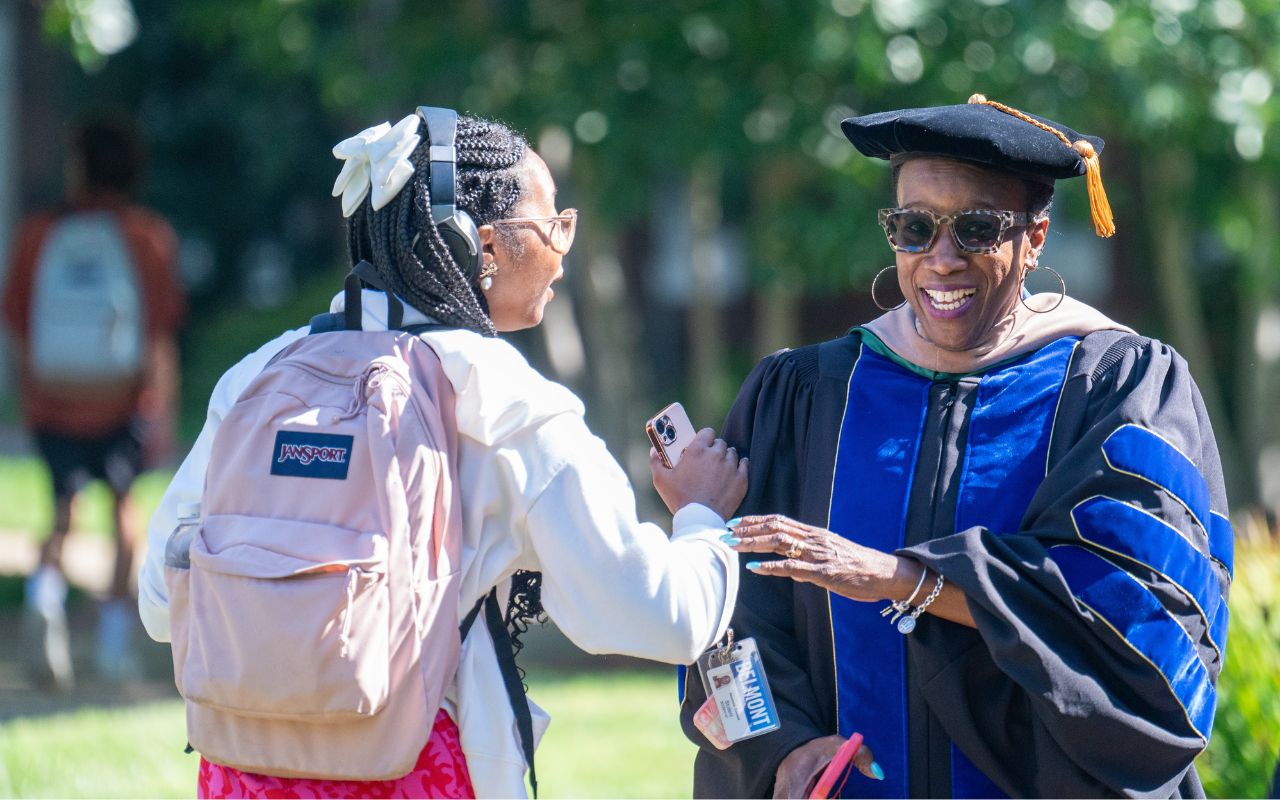 Faculty member and student talk at 2024 Opening Convocation at Belmont