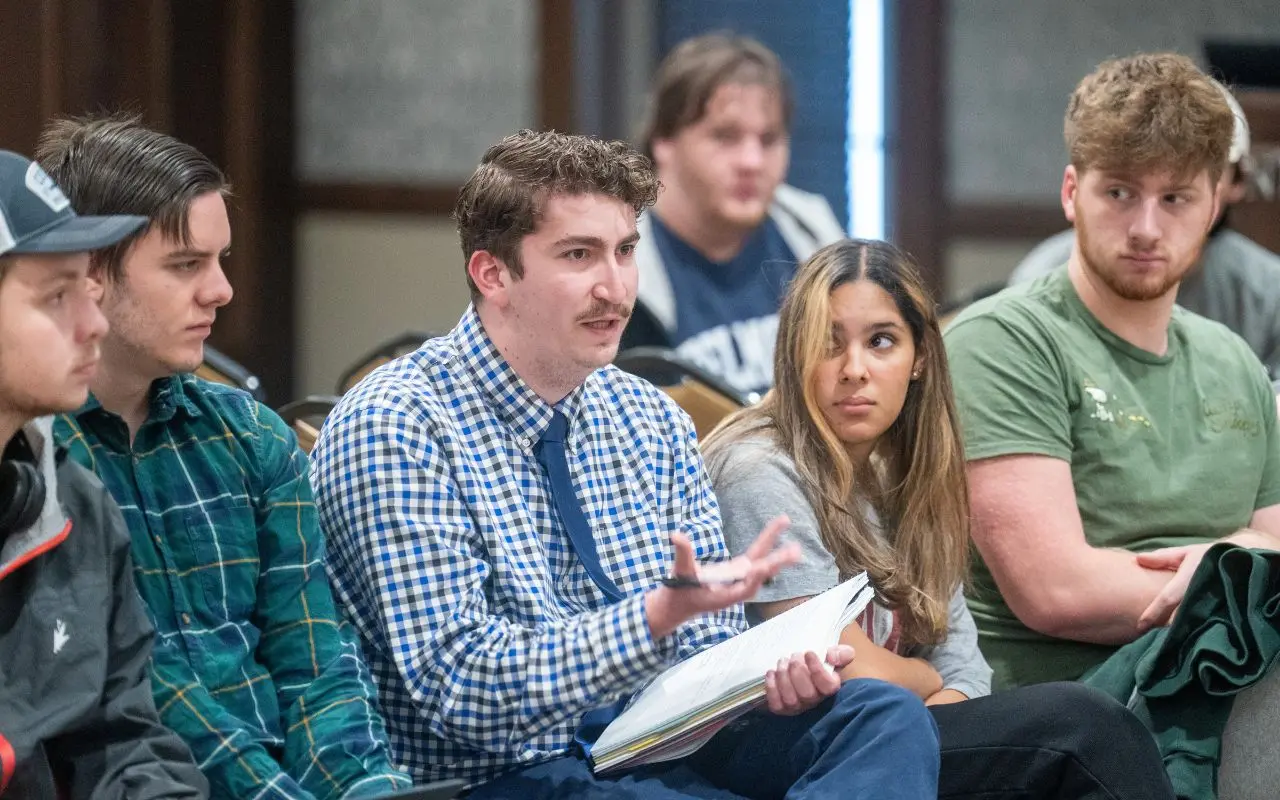 Students discuss in a circle
