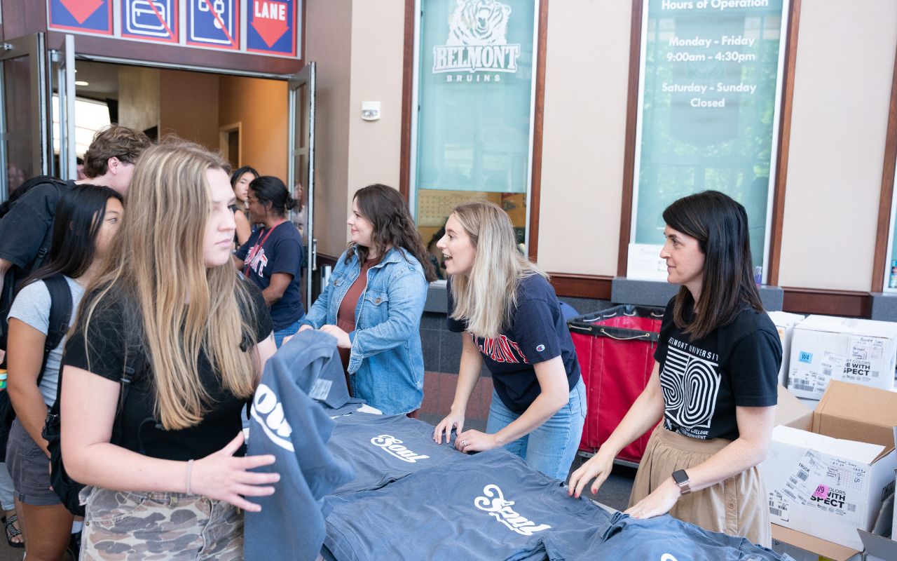 Belmont marketing members hand out SOUL t-shirts at 2024 Opening Convocation at Belmont