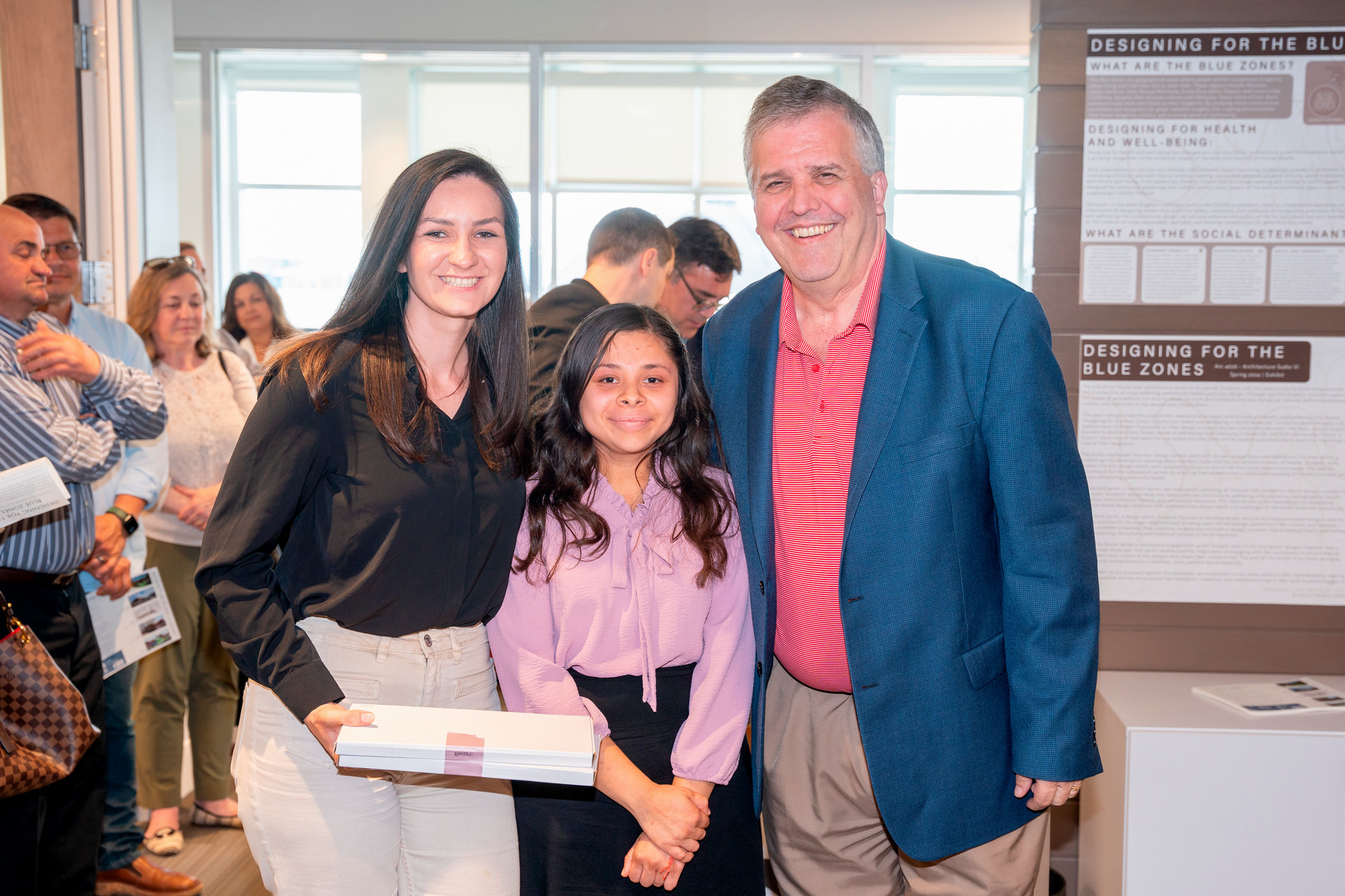 Design team pictured with University President Dr. Greg Jones