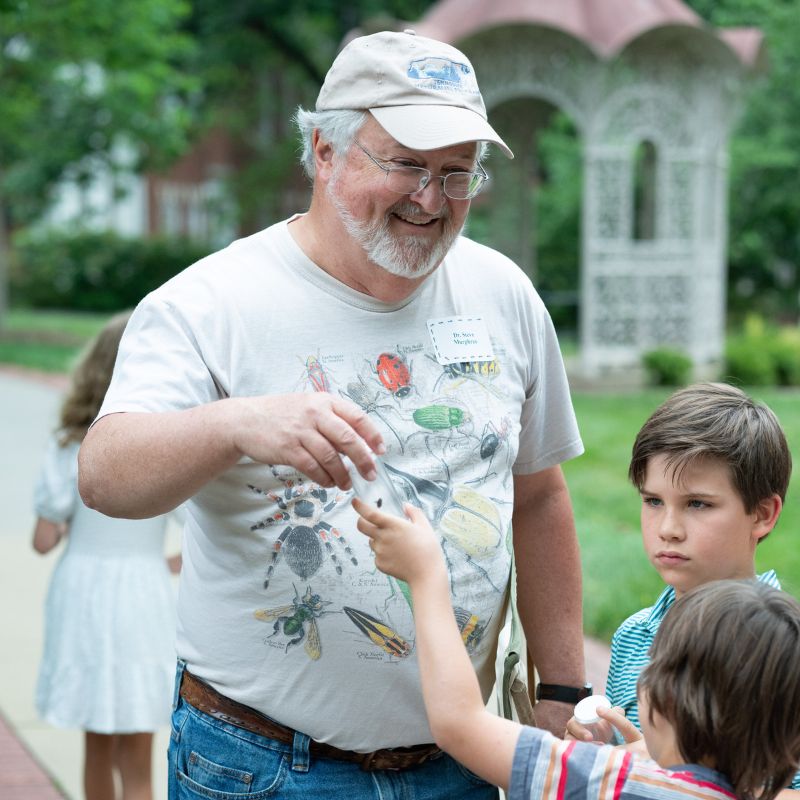 Dr. Murphree smiles with campers