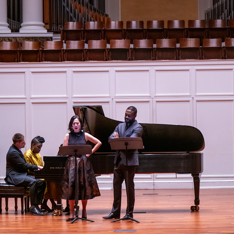 performers of Songs of Hope smile after a song