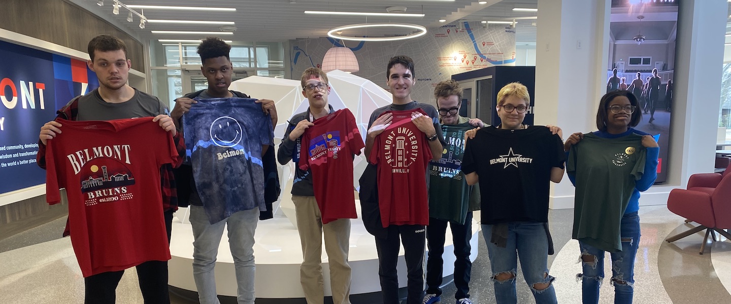 MNPS students holding Belmont shirts in the Bruin Shop