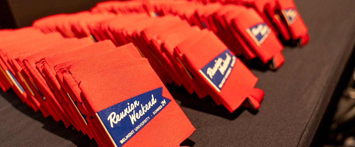 Reunion Weekend branded drink holders lined up on table