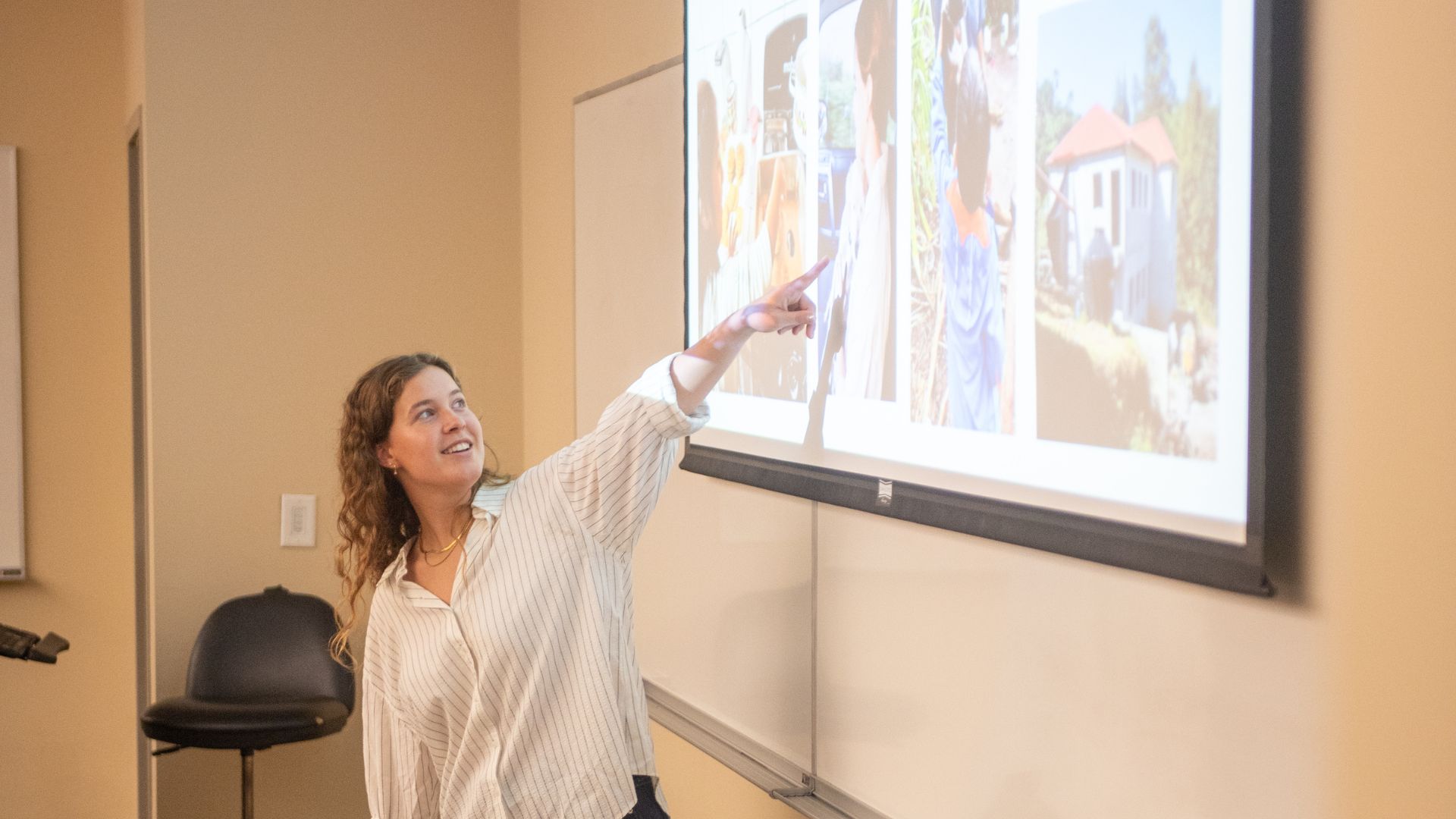 Yordy points to a photo during her presentation