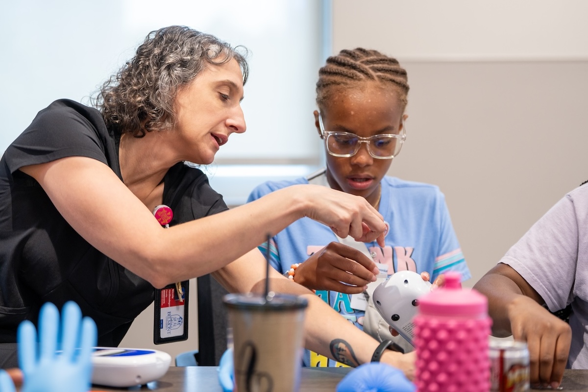 Student and faculty member work together