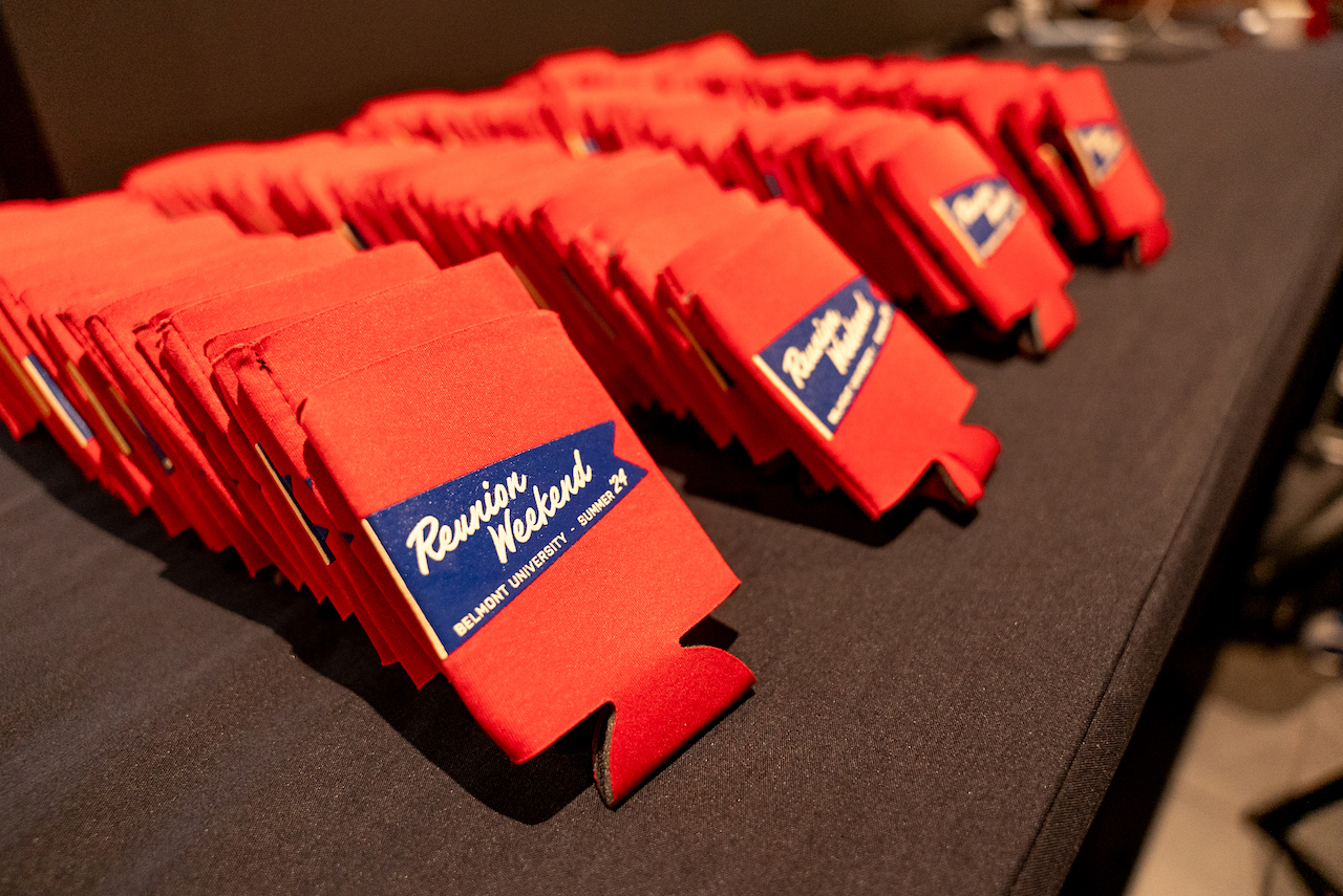 Reunion Weekend branded drink holders lined up on table